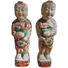 A Pair of Famille Verte Hoho Figures