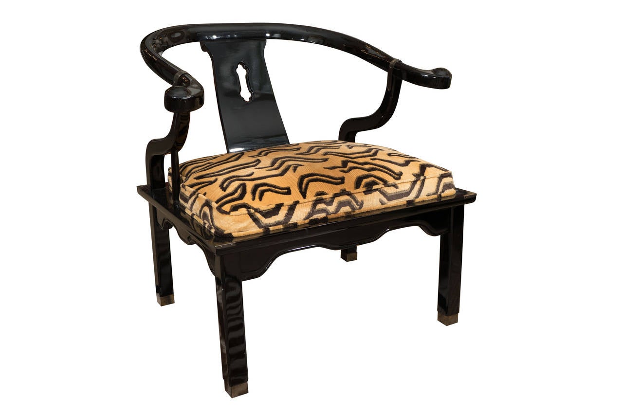 Pair of lacquered and brass low chairs with newly reupholstered Clarence house tiger velvet.