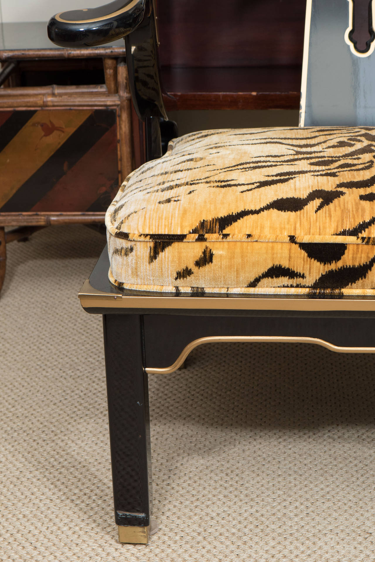 James Mont style Asian century lacquered and brass low chair with Clarence House tiger velvet.