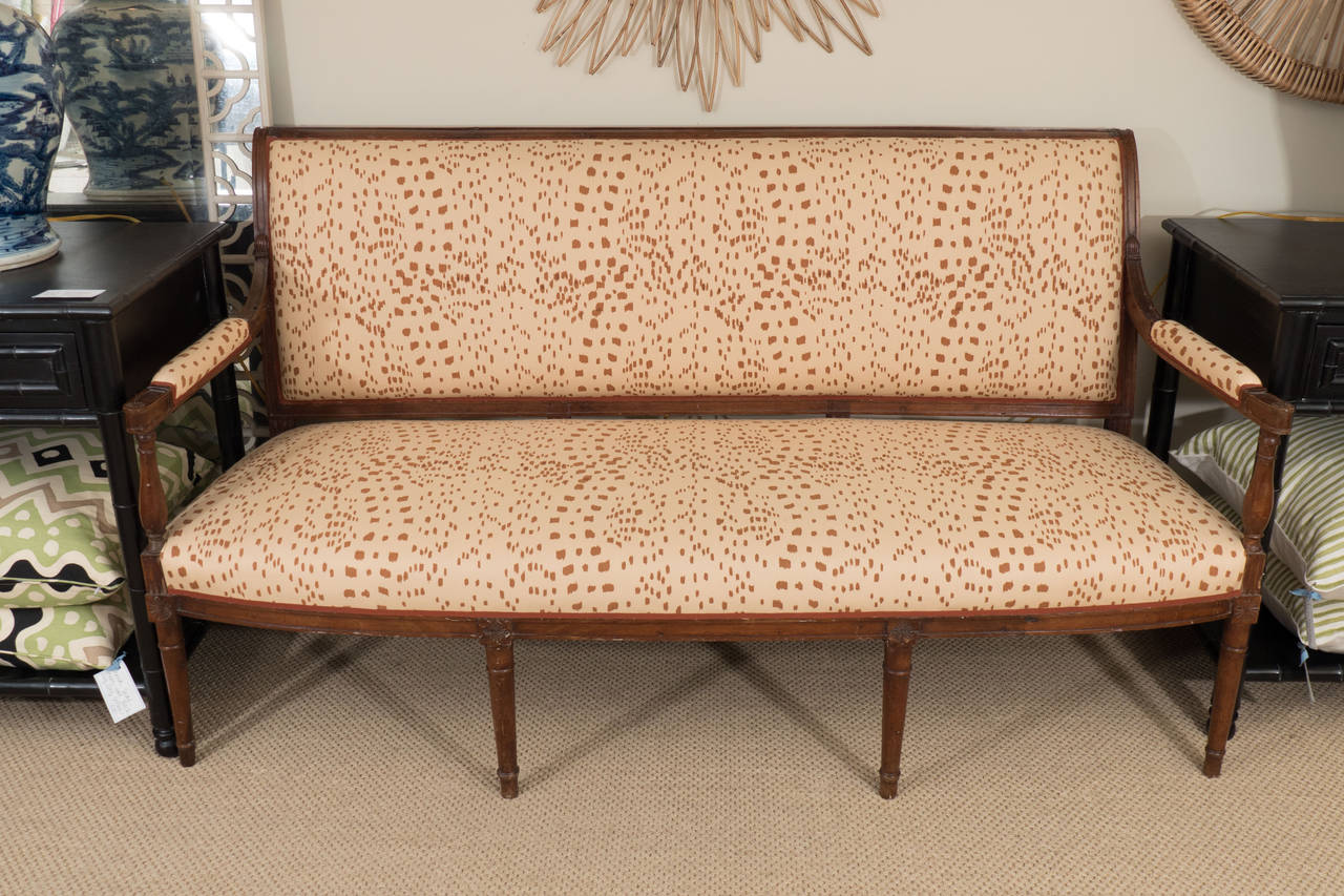 Has a wooden frame and is upholstered in Brunschwig and Fils' Les Touches fabric.