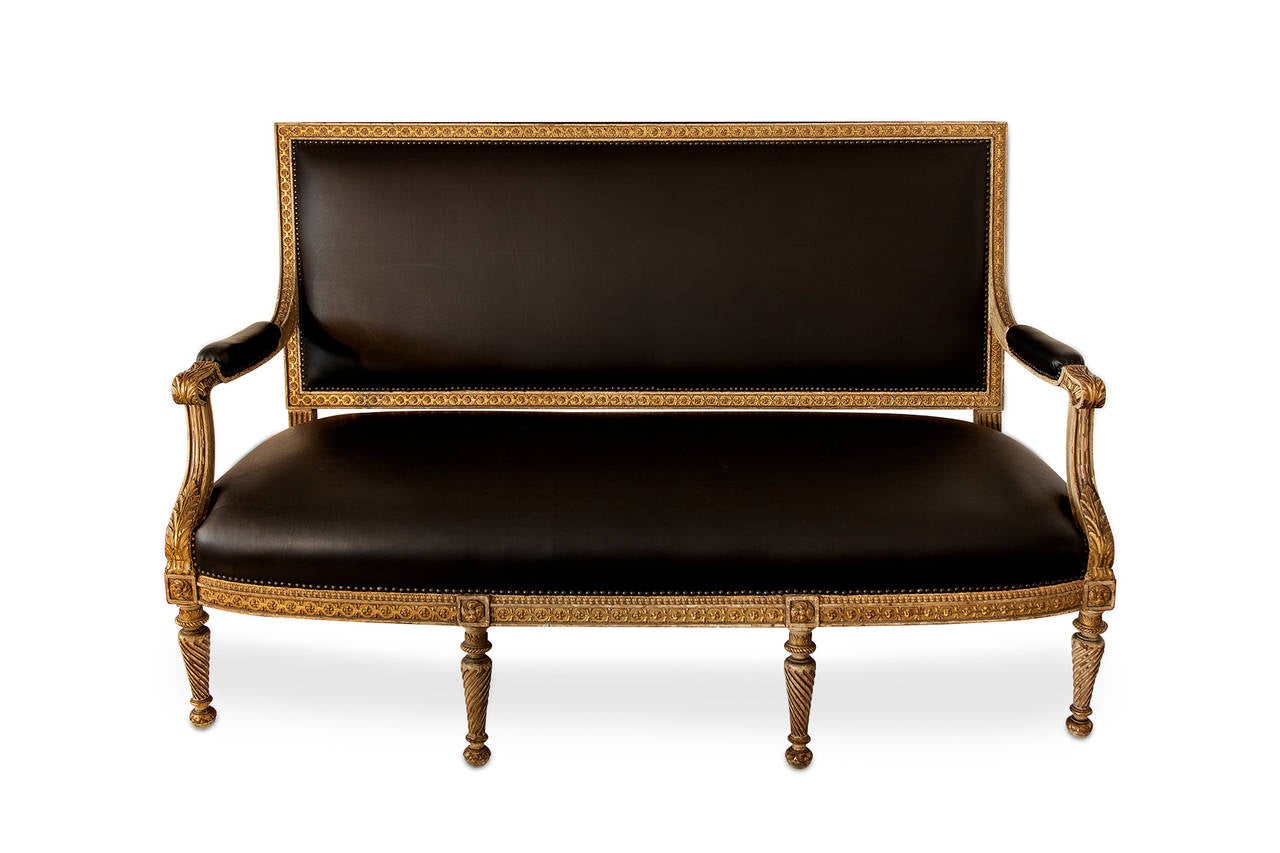Louis XVI sofa, made with wood and painted with burnished gold, France, 19th century.