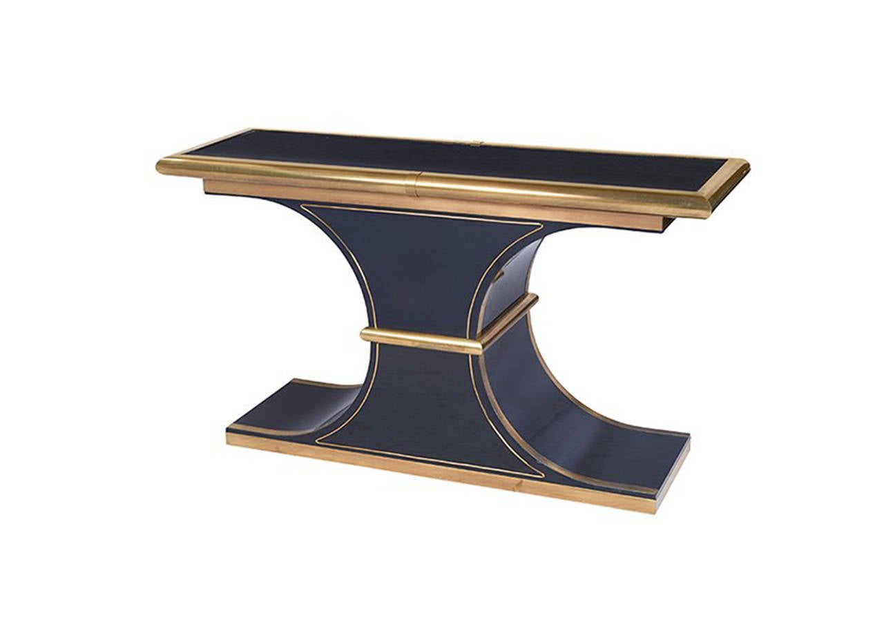 Double-sided modern black lacquered console with brass trim around top and brass inlay detail in sides, attributed to Mastercraft.
