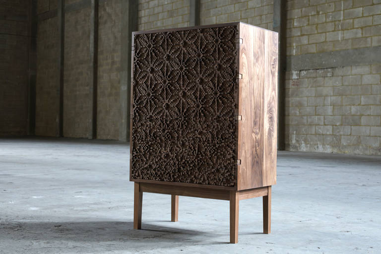 Three dimensional pixilated hemp leaves – inspired by a traditional Japanese lattice pattern typically used for kimonos – grace the full doors of the As No Ha highboy giving it an unexpected sculptural flair. The warmth and character of the walnut