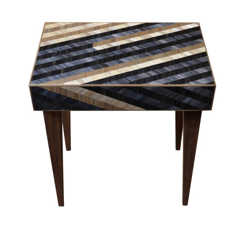Modern and dramatic, this table features a rich, natural texture created by an inlay of straw marquetry turned out in a palette of earthy neutrals. Adds interest and allure to any room. 

We specialize in custom commissions.
Custom materials,