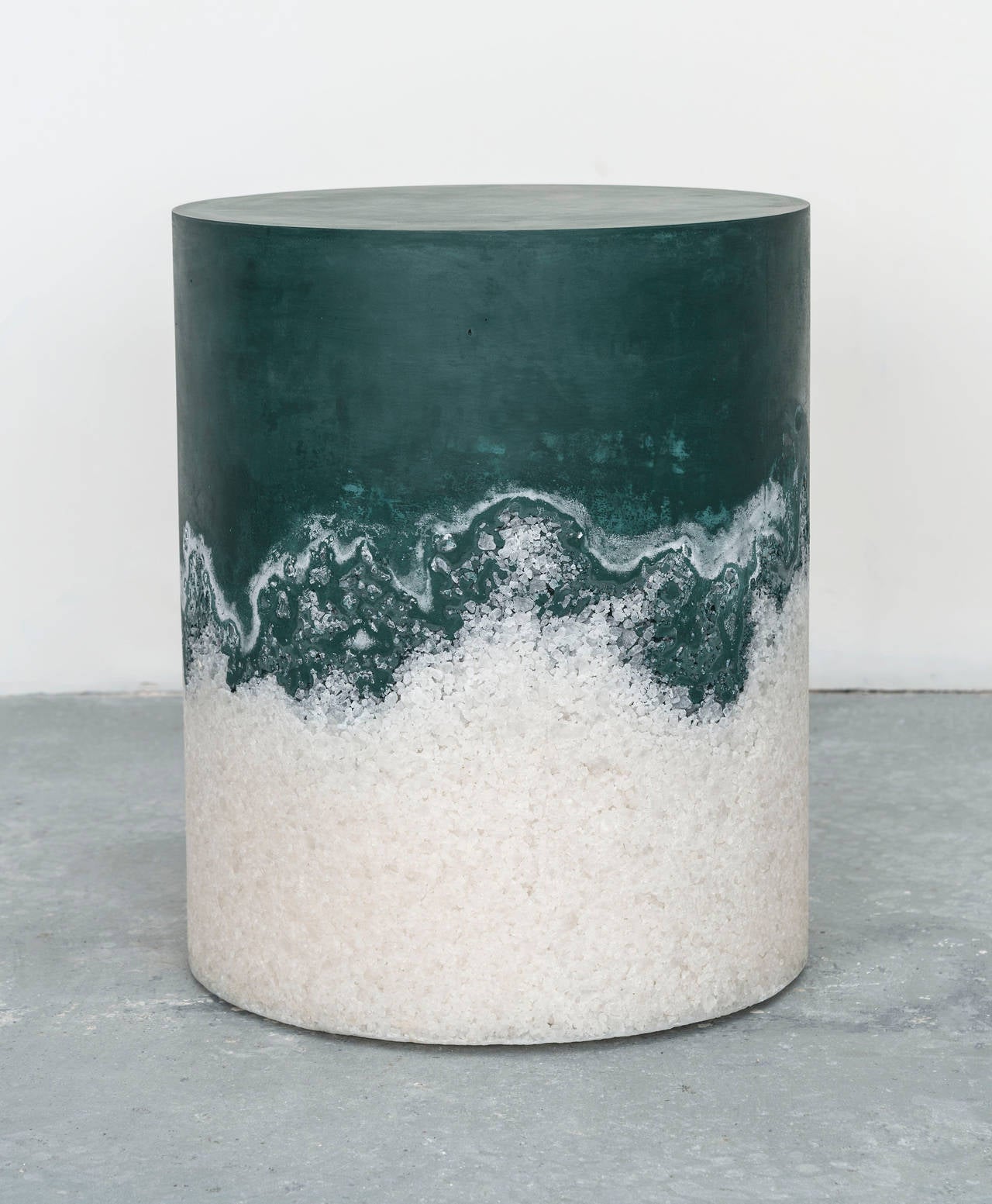 A drum stool fuses verdant green cement with white rock salt, producing exquisite strata of color and texture. A piece of singular beauty that works as a side table, stool or décor element.

We specialize in custom commissions.
Custom materials,