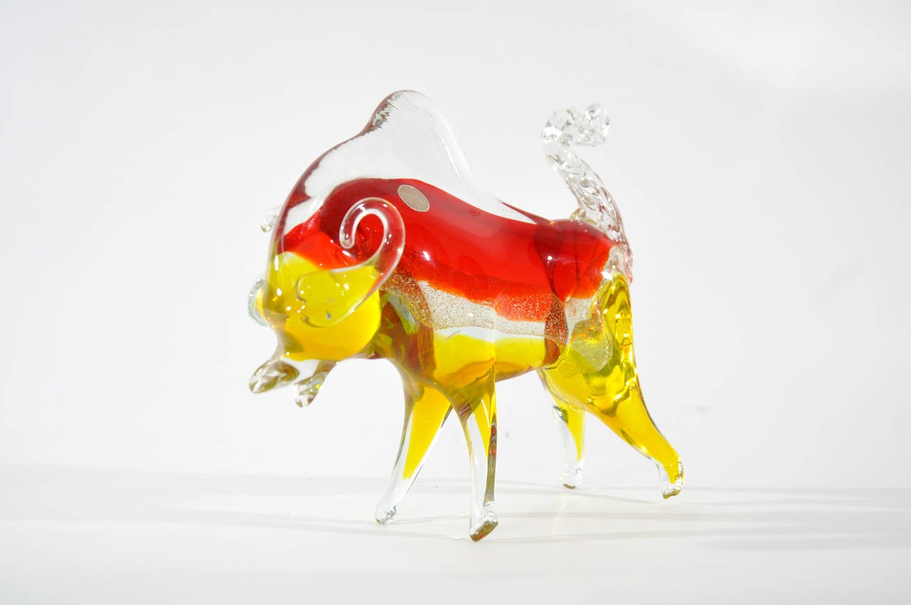 A beautiful Murano bull of good proportion.  The piece exhibits brilliant, bright colors with a sparkling gold tract running through the bulls body. Original Murano sticker to the piece, excellent condition.

The piece measures H 9 x W 9 x D