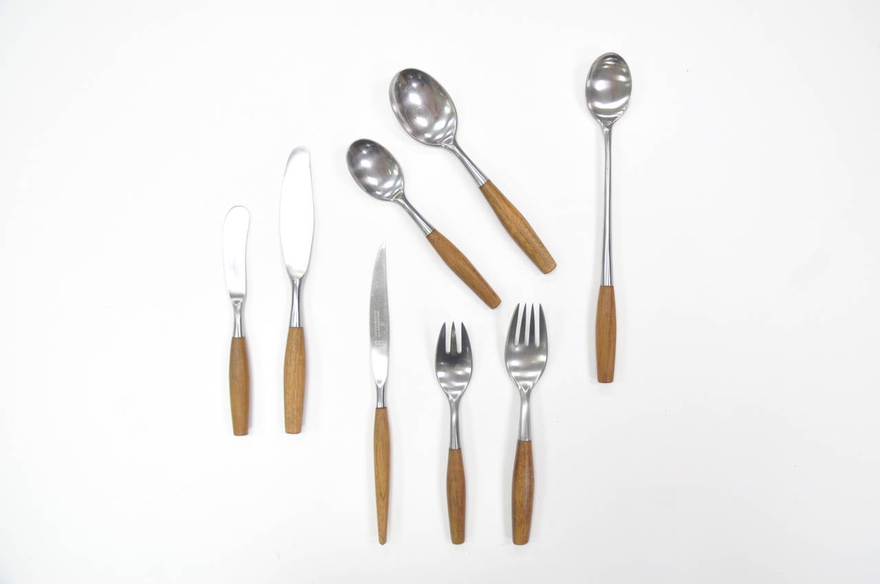 A beautiful set of Dansk Teak and Stainless flatware.  The set includes 13 drink stirring spoons, 9 table spoons, 17 teaspoons, 7 salad forks, 7 dinner forks, 12 butter forks, 11 dinner knives, 11 steak knives, 3 serving spoons, 2 ladles, 1 serving