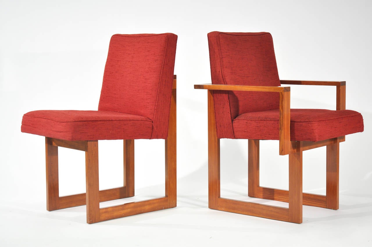A woefully rare set of Cubist dining chairs by Vladimir Kagan. The set consists of four armchairs and six side chairs in original upholstery. They are in good vintage condition in a golden warm wood tone.

In 2001, Armani selected this chair to be