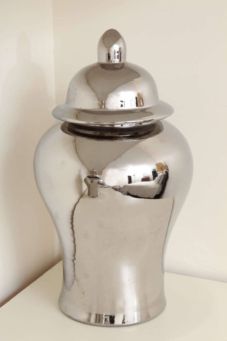 Each porcelain jar glazed in reflective silver, very dramatic and glamorous. In perfect condition. No chips, etc.