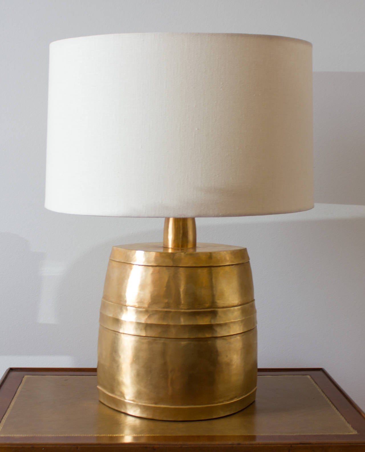 This elegant table lamp features a 24-karat gold plate finish.