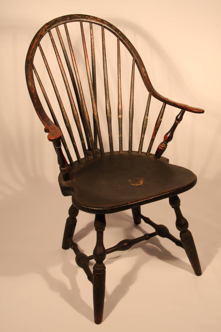 Windsor continuous armchair with bold turned arm supports, legs, and stretchers, signed on bottom E. B. Tracy.   Ebenezer Tracy Sr. was considered one of the most preeminent chair makers in CT.

Chairs produced by him and his son are some of the