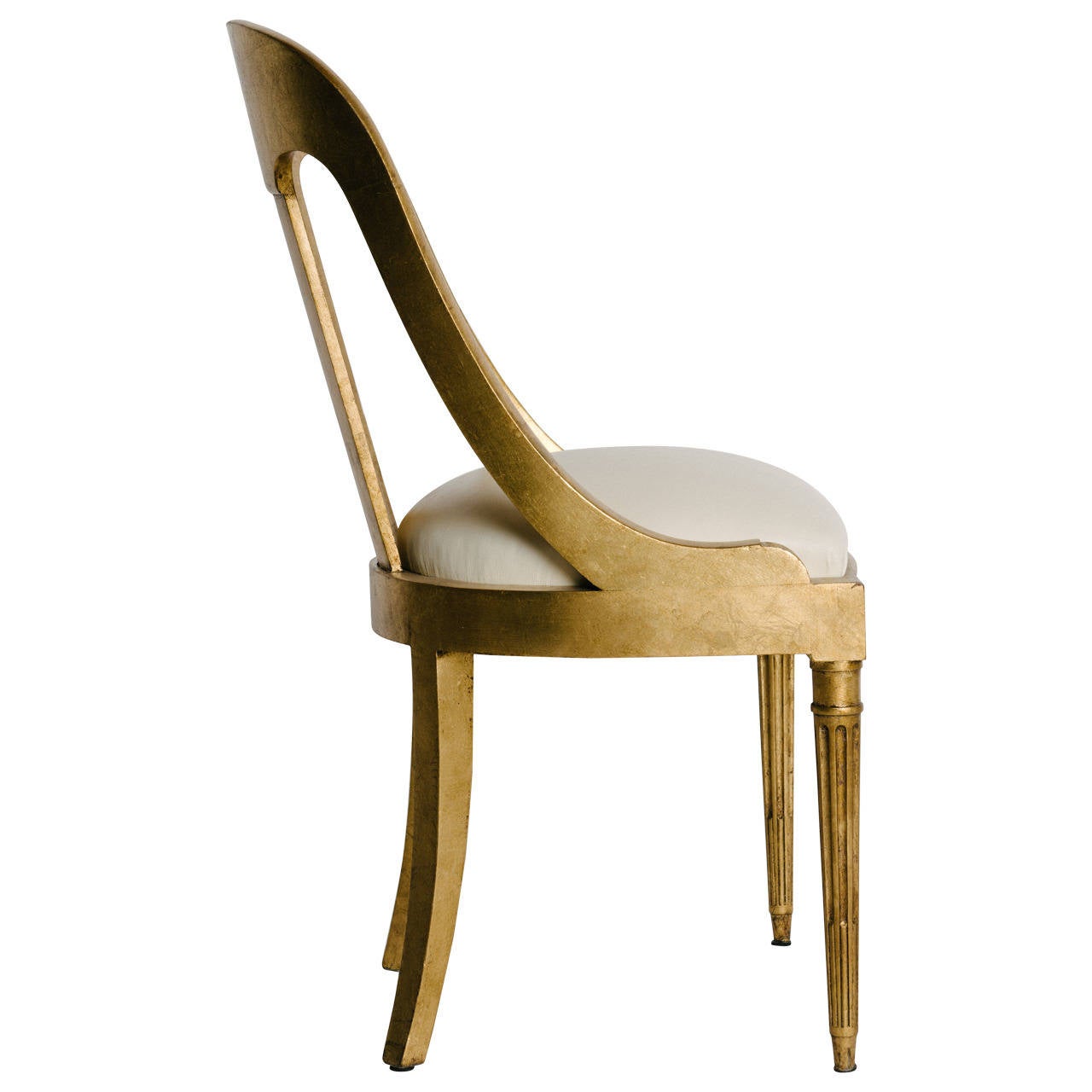 Period Charles X gilded chair newly upholstered with ecru leather.