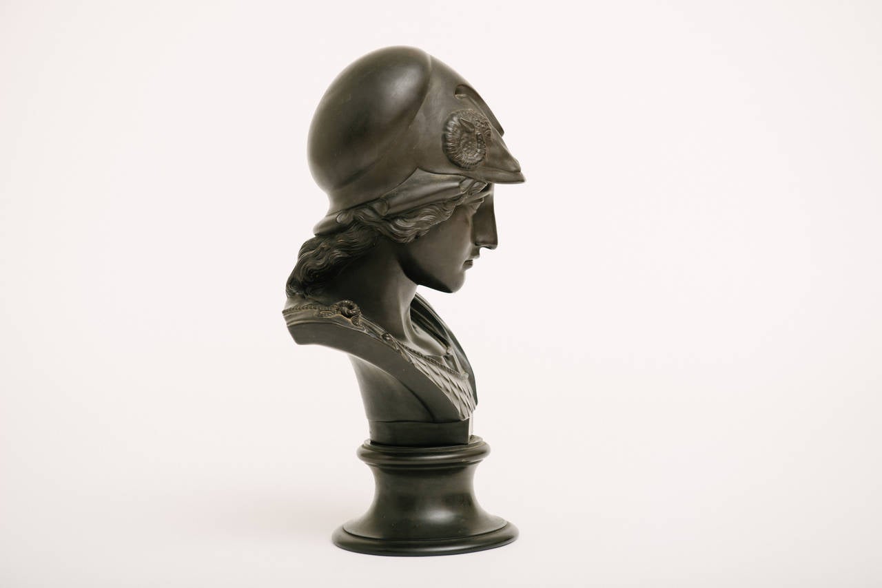 A wonderful 19th century Wedgwood black basalt Minerva bust.
Minerva was the goddess of wisdom and sponsor of arts, trade and strategy.
This signed piece features a stately double ram's head helmet and scaled armor in excellent condition.