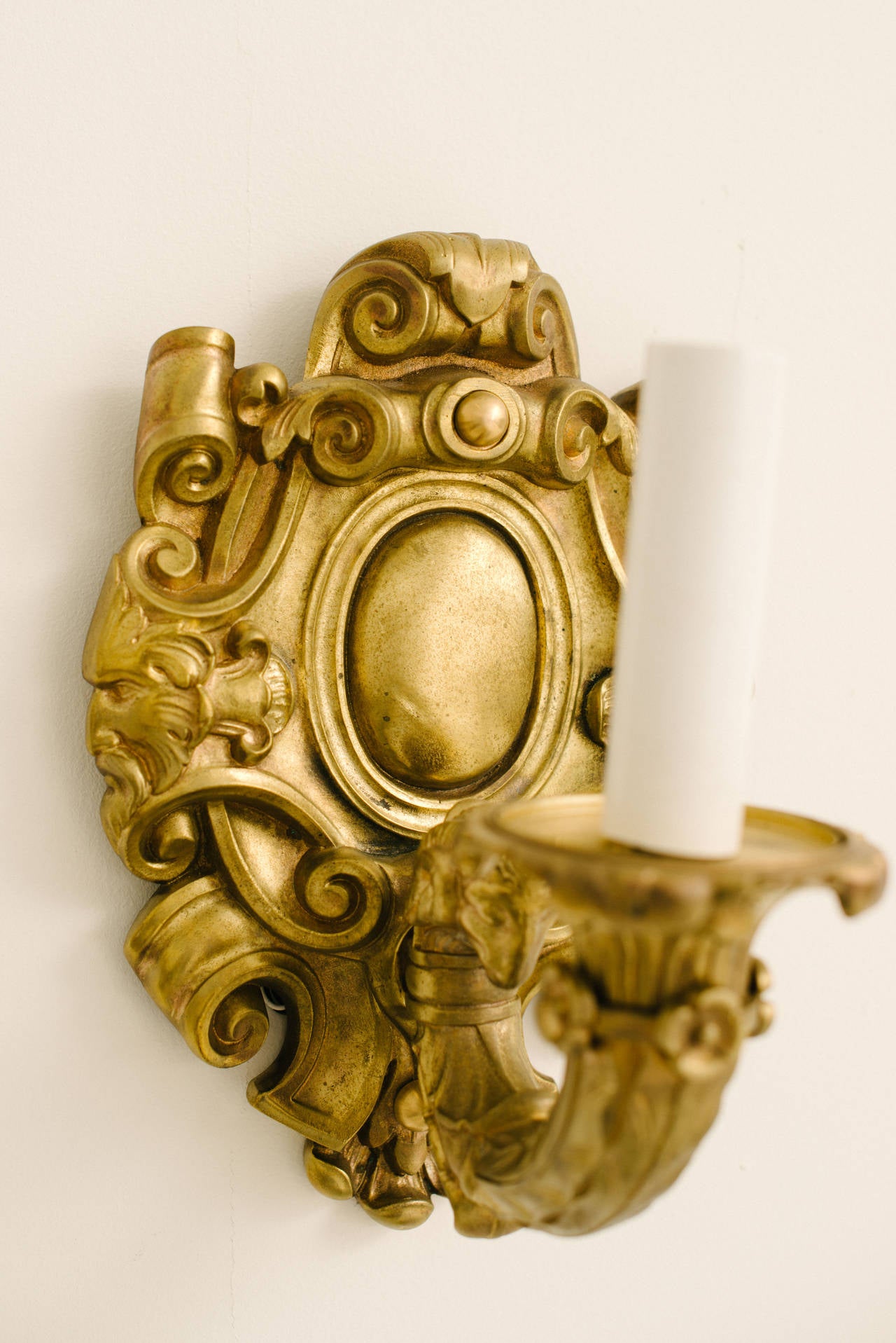 Late 19th Century French Louis XV bronze doré wall sconces with beautiful scrollwork and face detail. These sconces have been newly wired with UL listed parts.

Set of four can be split into two pair by request and will be sold at 3800.00 per pair.