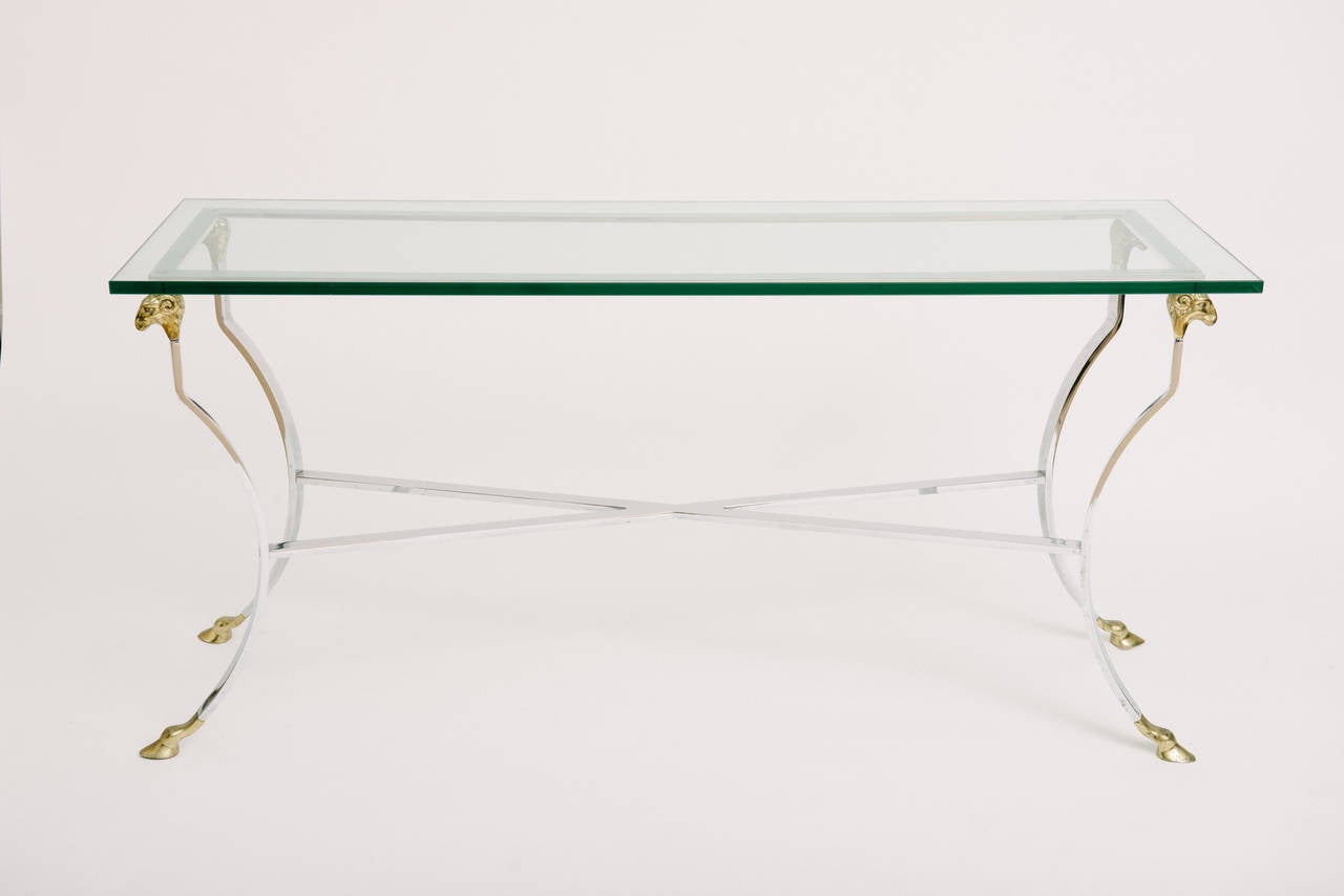 Italian Mid-Century Modern chrome console or sofa table with brass ram's head and hoof accents.