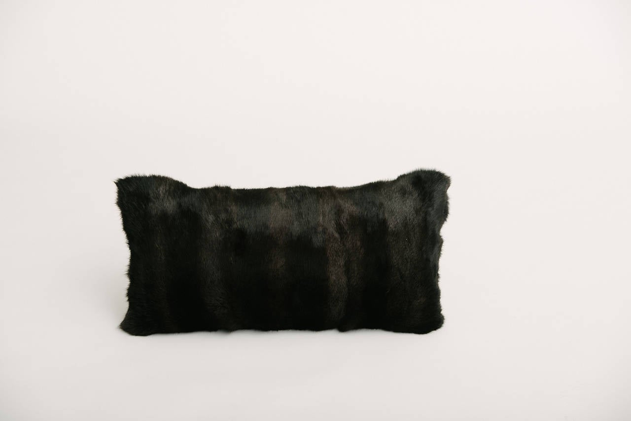 A custom luxurious Rex rabbit fur pillow with feather down fill.