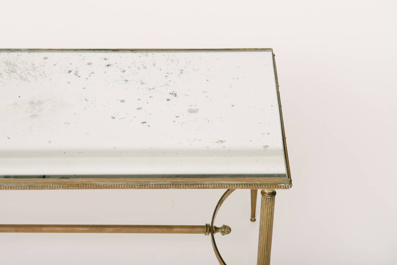 French, 1940s brass cocktail table with mirrored top.