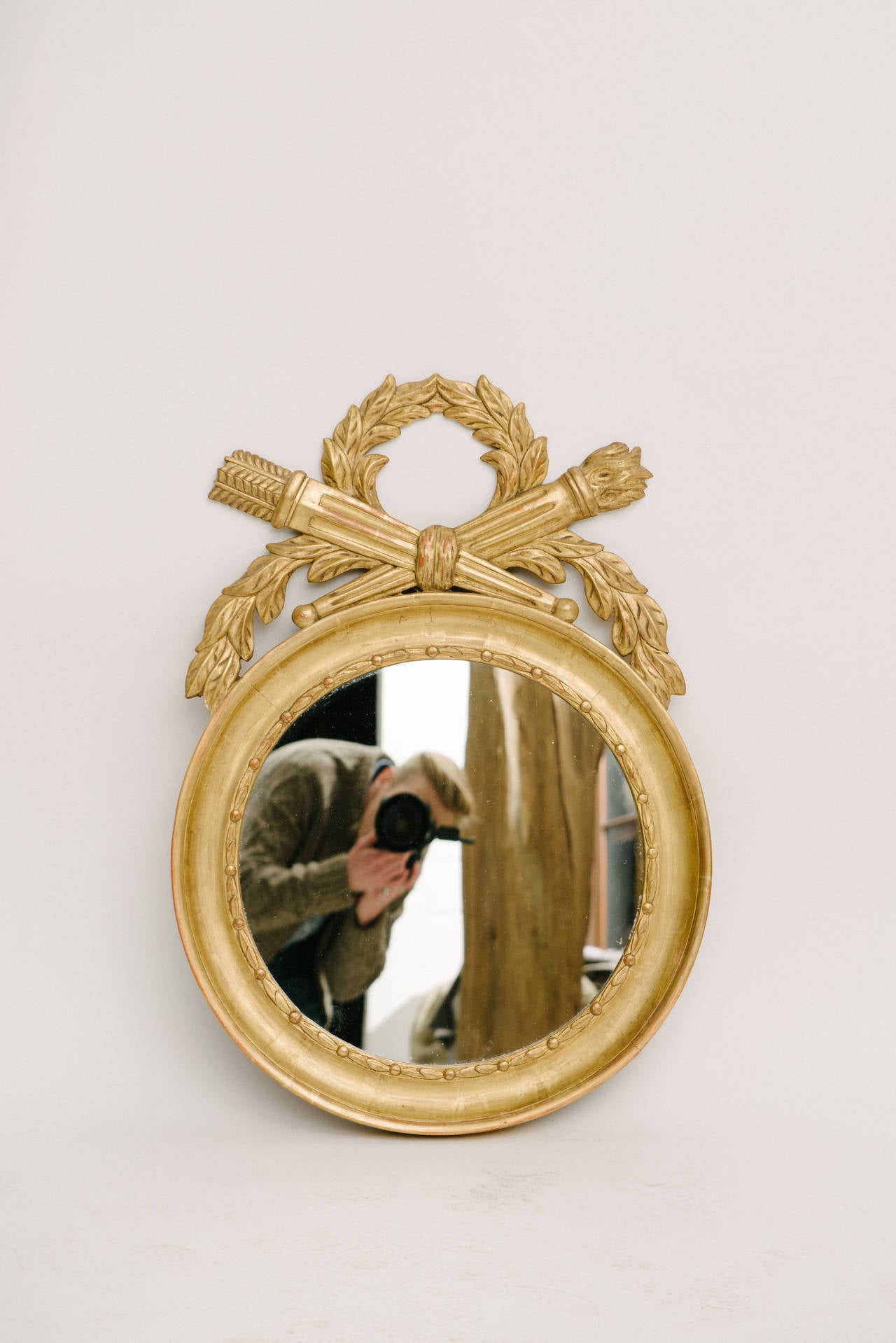 19th century French giltwood round mirror.