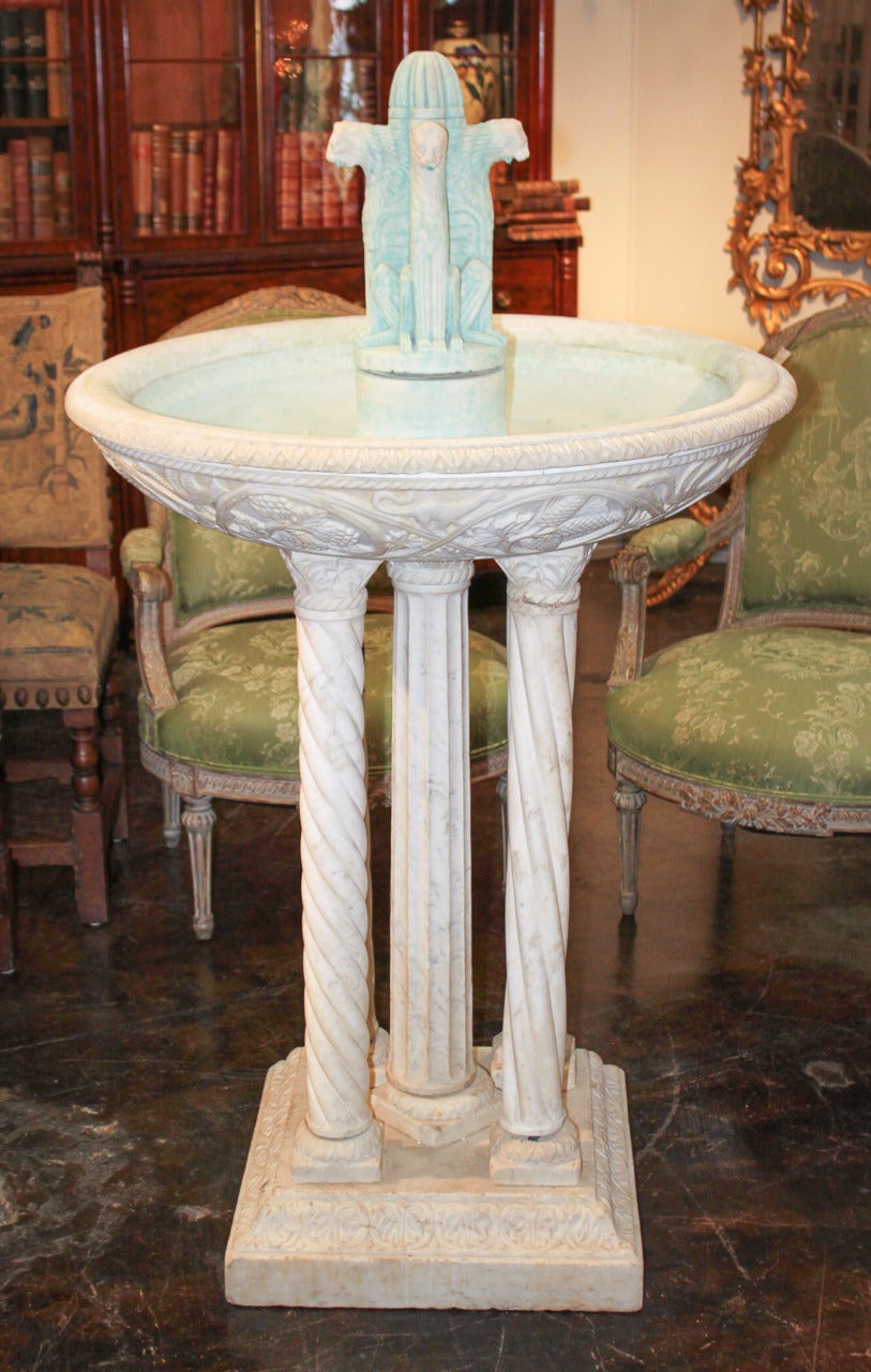 Elegant hand carved Italian Carrara and statuary marble fountain. Having winged lion spigots, bowl adorned with flora and fauna motif, and resting on five column supports. Please view all pictures to enjoy, serious inquiries are welcome!