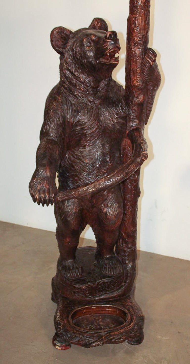 Exceptional German Black Forest carved bear hall stand. Having excellently detailed carvings of a mother bear coaxing her three bear cubs down from a tree, and exhibiting great technique and proportions.