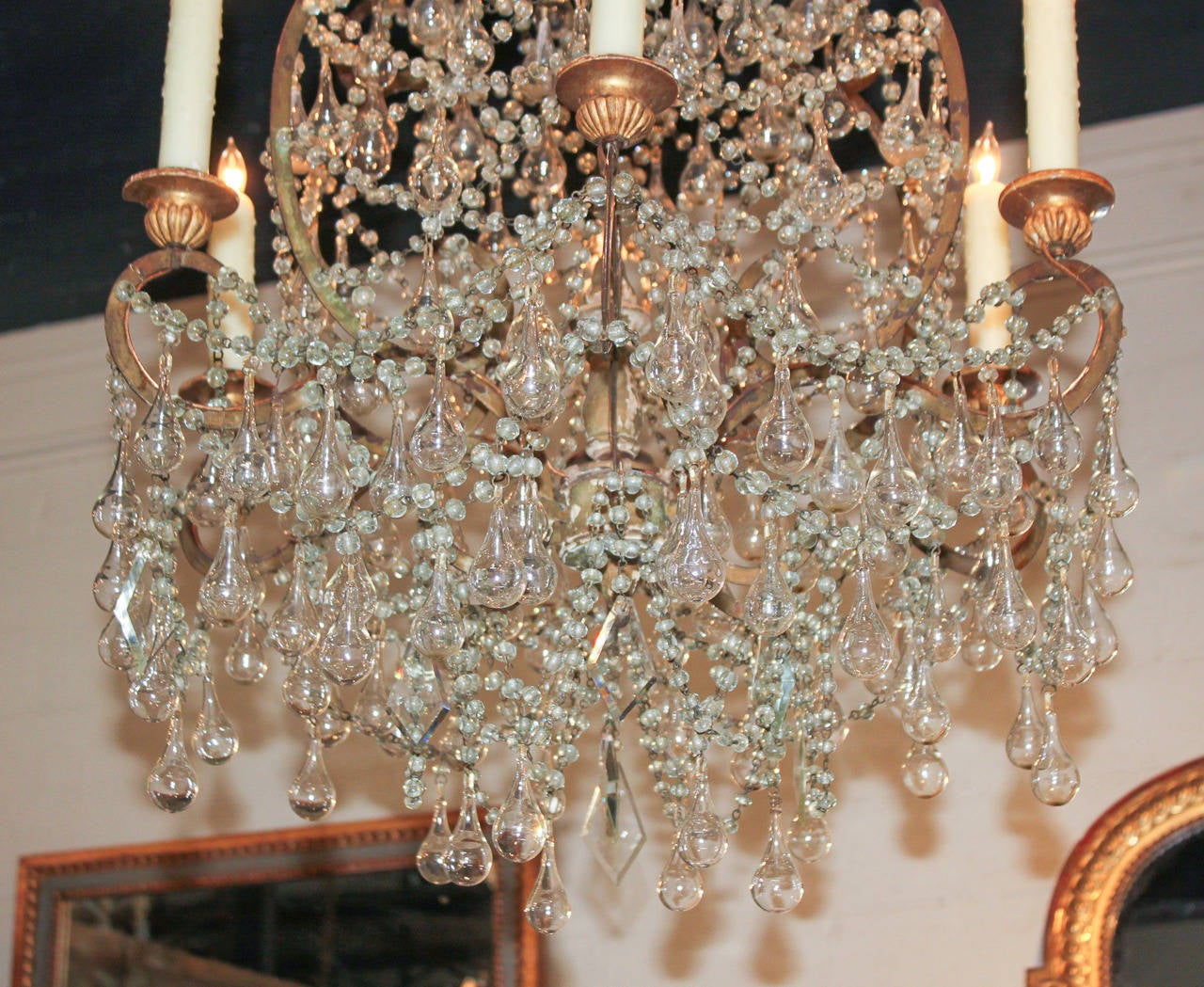 Fabulous Italian crystal 6-light chandelier profusely adorned with beaded crystal stands and drop prisms.  Having lovely scrolling frame terminating in elegantly simple candle cups.  Beyond chic for numerous designs!