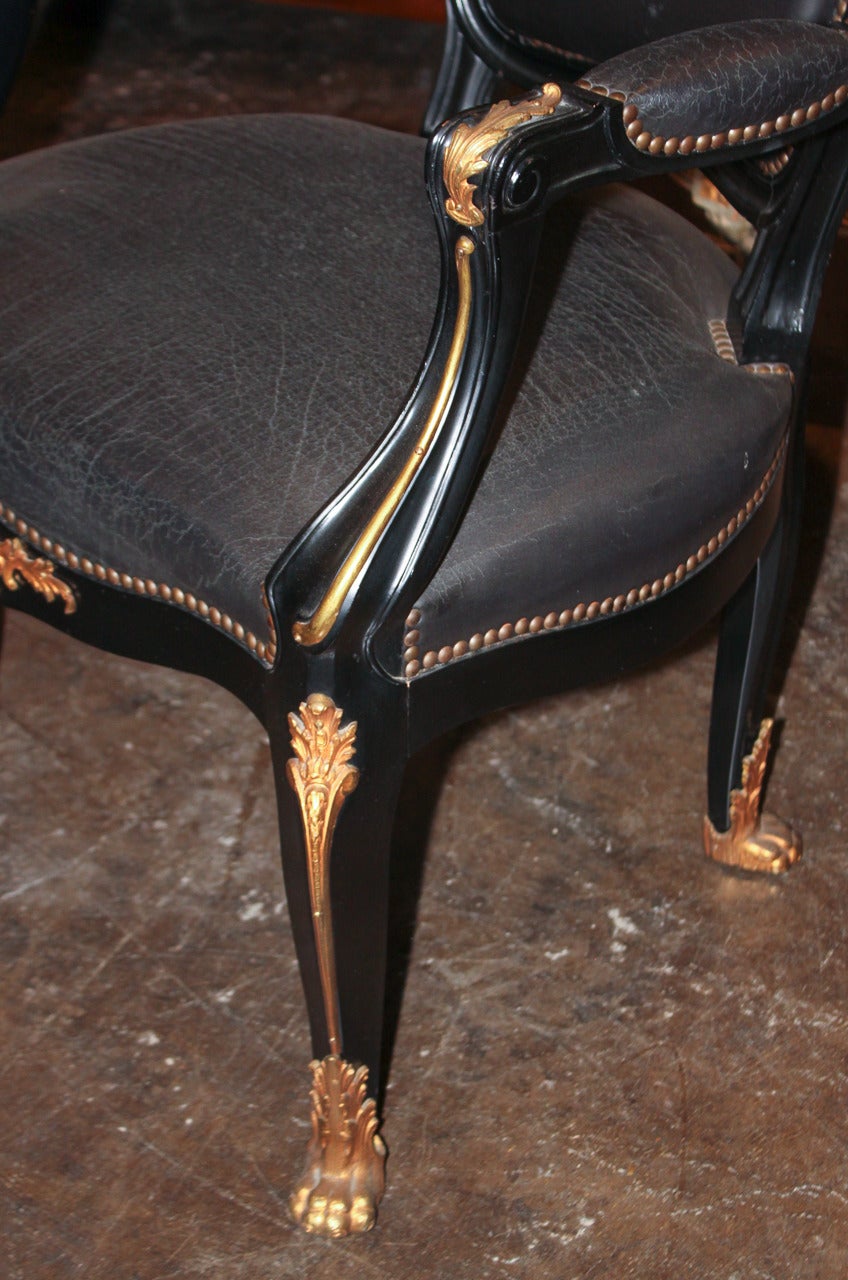Handsome black lacquered and gilt bronze trimmed desk chair in Louis XV style.  Having bronze shell cast top rail over cabriole legs terminating in claw feet.  Please view all pictures to enjoy, serious inquiries are welcome!