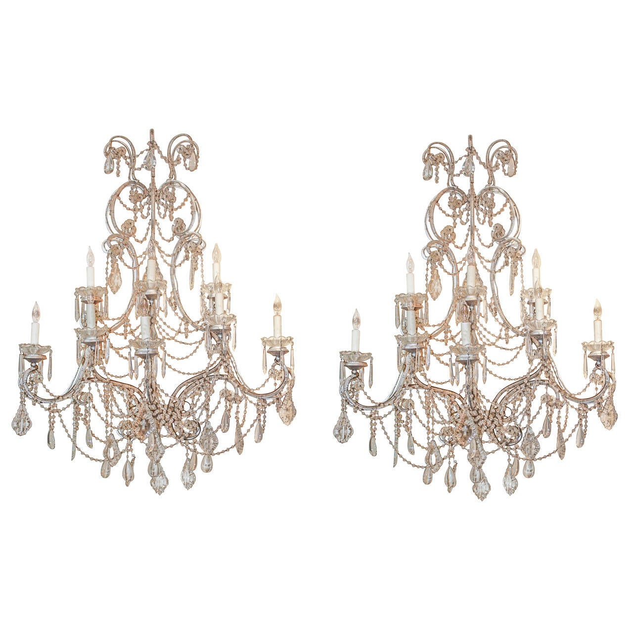 Gorgeous, impressively large pair of Italian beaded crystal sconces.  Having 8-lights on each sconce, cut crystal bobeches and drop prisms, and tear drop prisms.  