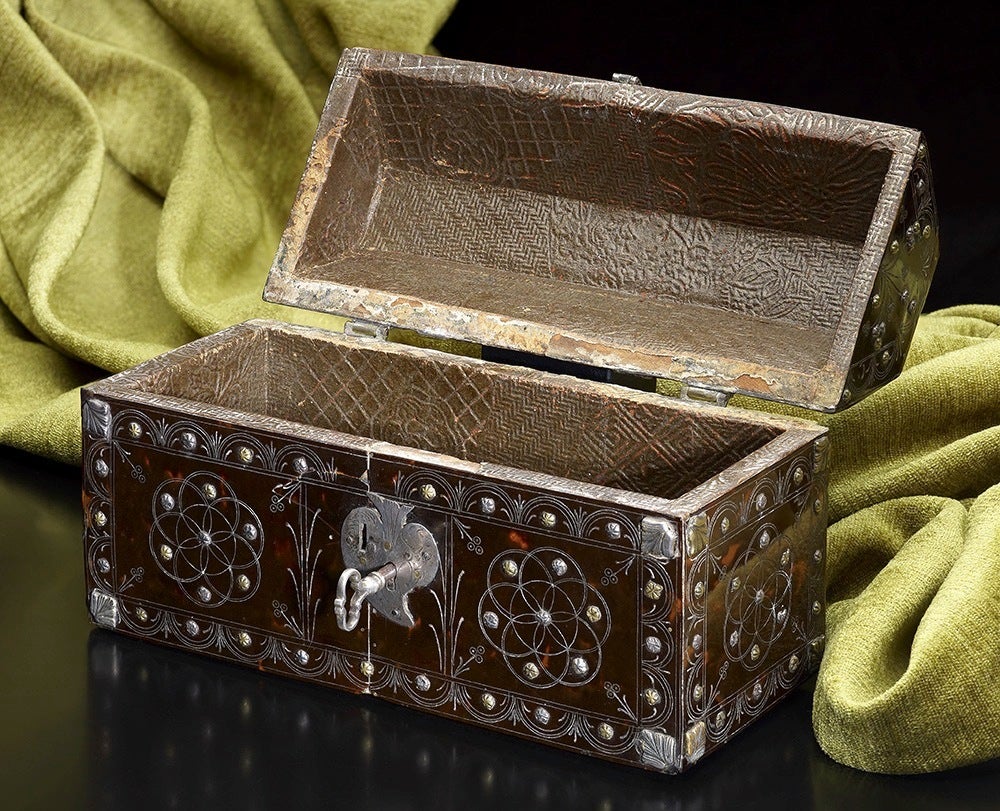 An extremely rare Spanish Colonial tortoiseshell casket, late 16th or early 17th century; approximate 8 1/2 inches wide, 5 inches tall and 3 1/2 inches deep. The casket is intricately decorated all-over with floral motifs and highlighted with a