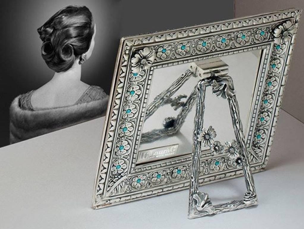 Harmony turquoise is an Arts & Crafts square silver picture frame designed by Laura G for Art with Heart.
It is a wonderful lost wax silver model hand chiselled by master craftsmen with a petit fleur design, typical of 16th century Siena