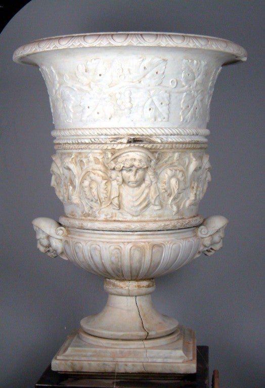 A high quality carved Carrara marble Italian vase.
Top part carved with grape leaves. Central with human faces, an two heads of lion at the bottom.