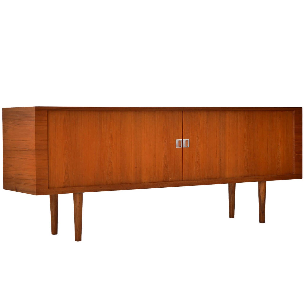 Iconic Hans Wegner credenza in teak. All original hardware, with tambour doors, and adjustable drawers and shelves.