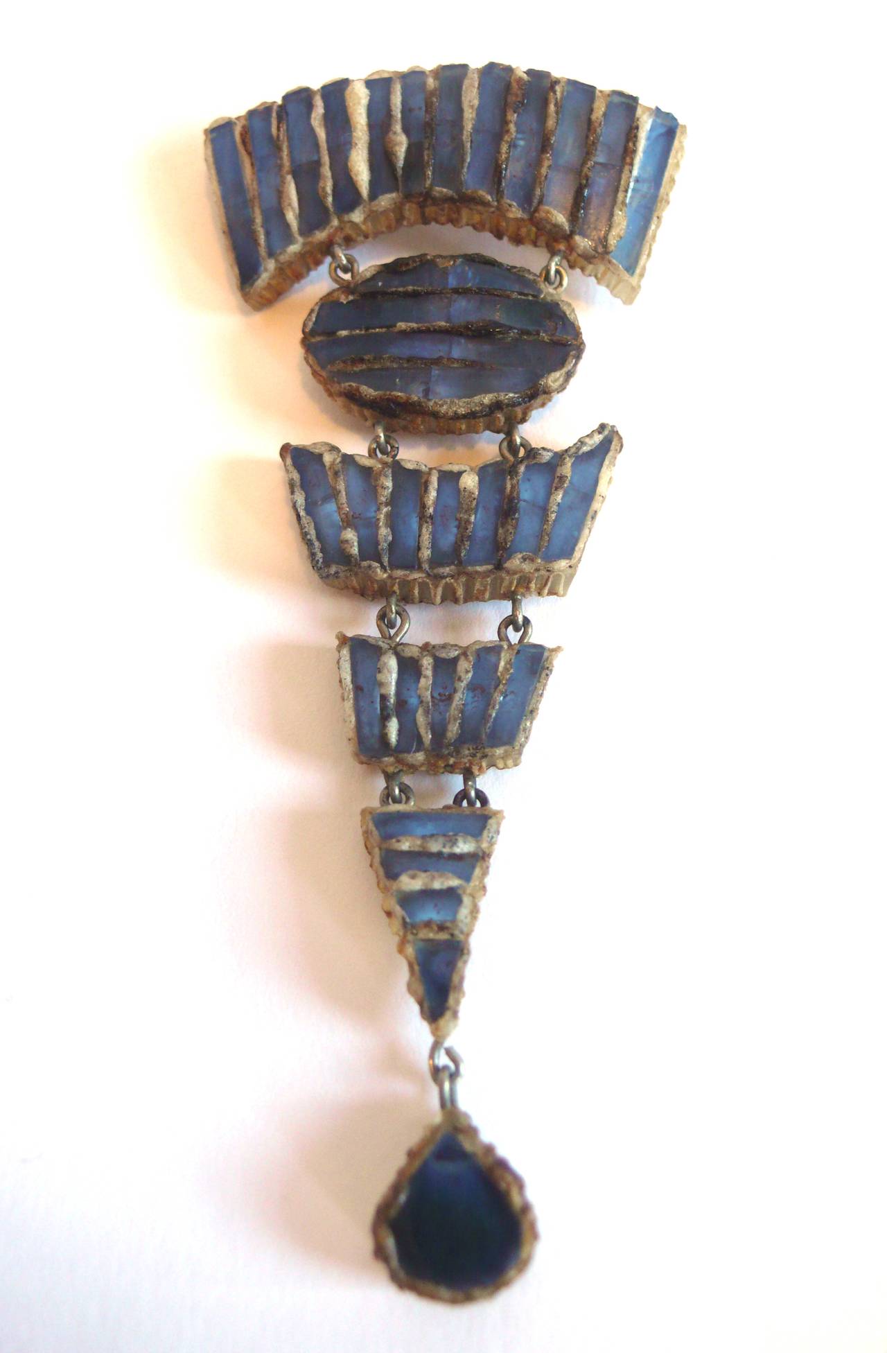 Line Vautrin talosel articulating brooch encrusted with blue colored mirrored glass.