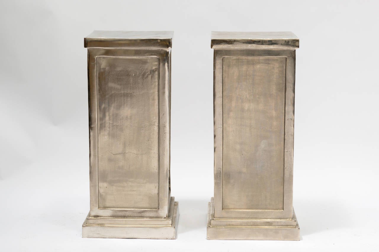 Pair of classical style metal alloy pedestals - fun twist on a Classic piece of architecture.