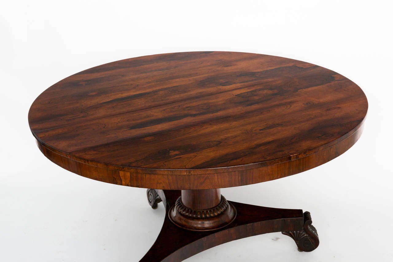 A rosewood English tilt-top center table, circa 1830. Beautifully displayed either up or down.