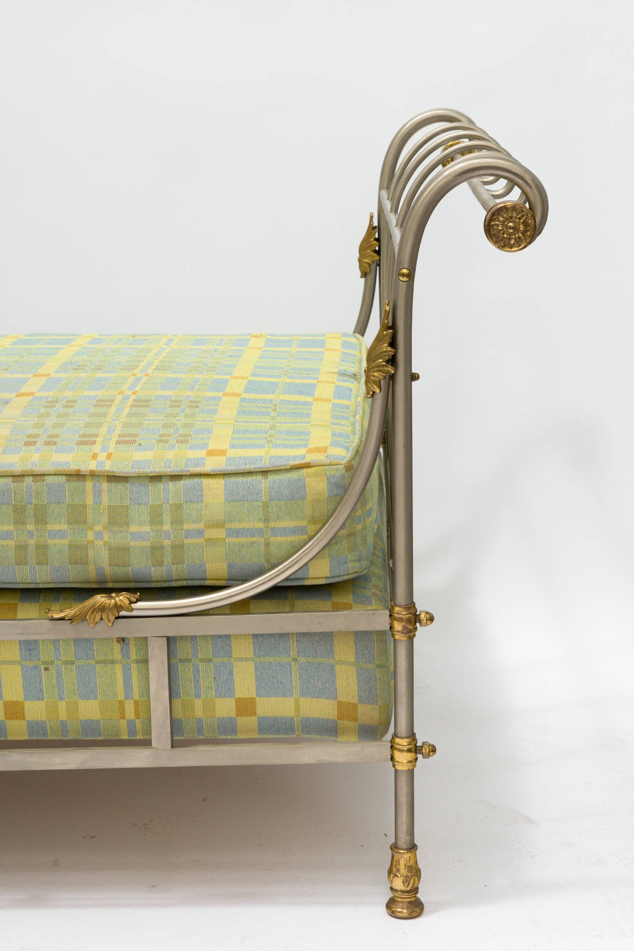 Italian classical steel daybed with brass ornamentation.