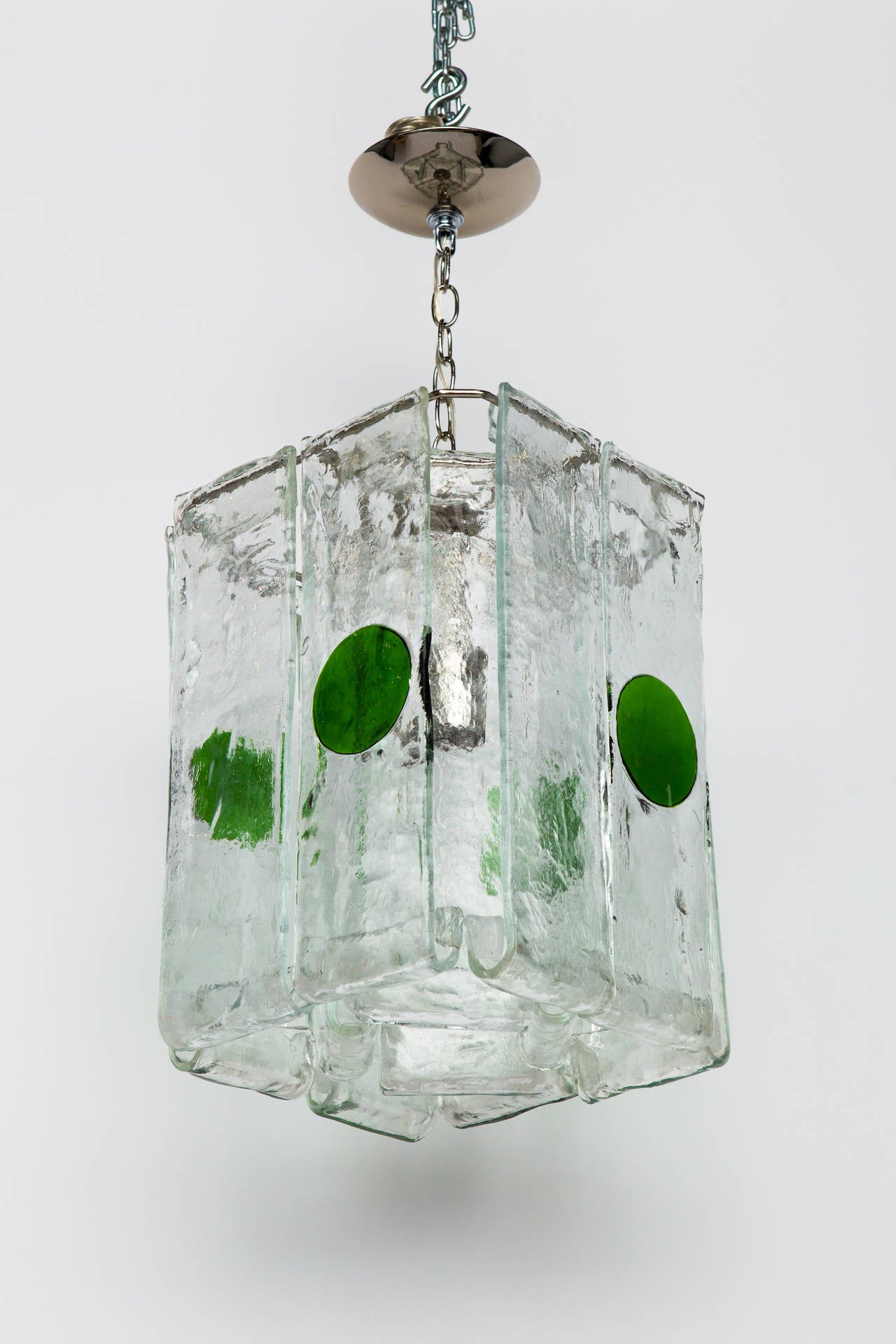 Pendant featuring 12 hung cast-glass panels with textured surfaces. 
Green spot pendant by Mazzega
Nickel steel frame with one socket. Made in Italy.
Measurement just for the glass body is 17