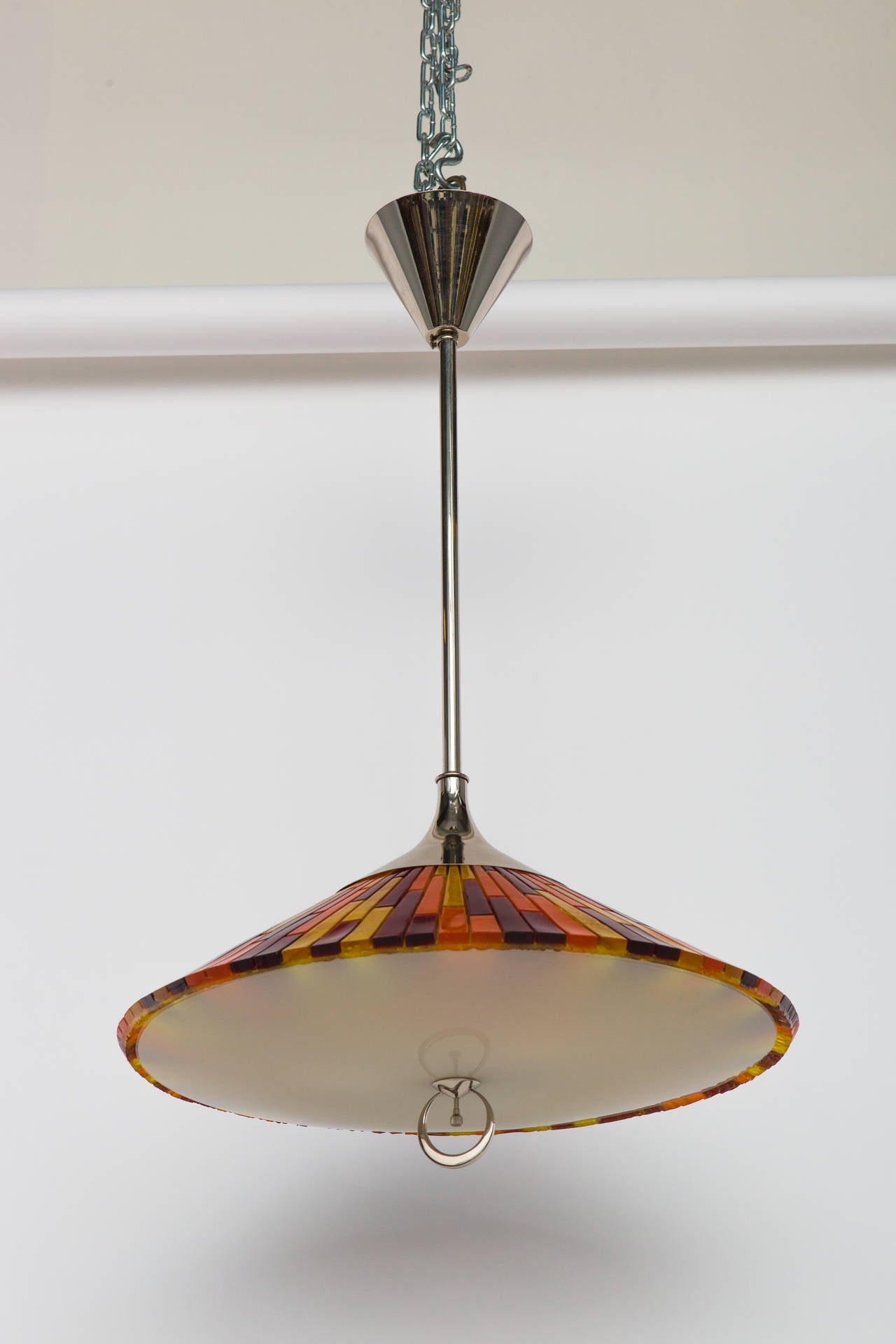 Italian pendant composed of colorful acrylic elements. Nickel-plated hardware with opaque glass diffuser. Ornamental metal ring contains a on/off switch. Restored and rewired with three sockets.