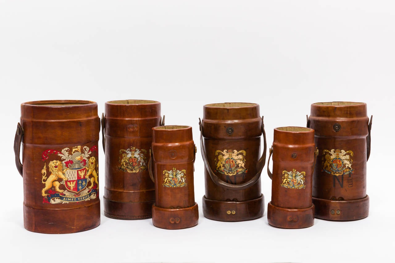 19th century English leather Ammunition carriers. Cordrite buckets. Used to hold gun powder for the Royal Navy.

Each bucket is priced separately from $575 to $900.

Measures: Large height 15.75
