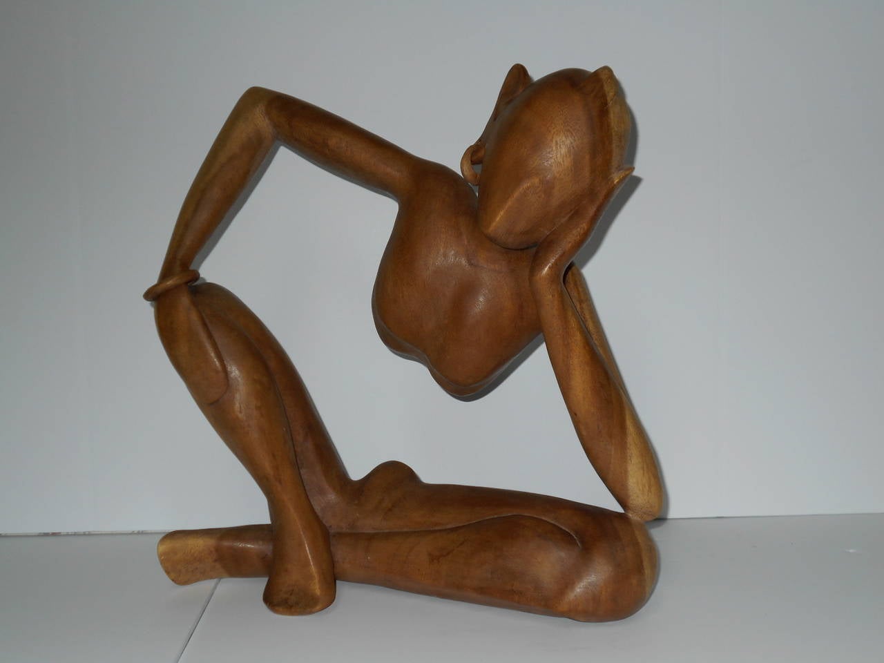 Mid-Century wood carved sculpture from Indonesia. It looks to be carved of one piece of wood.