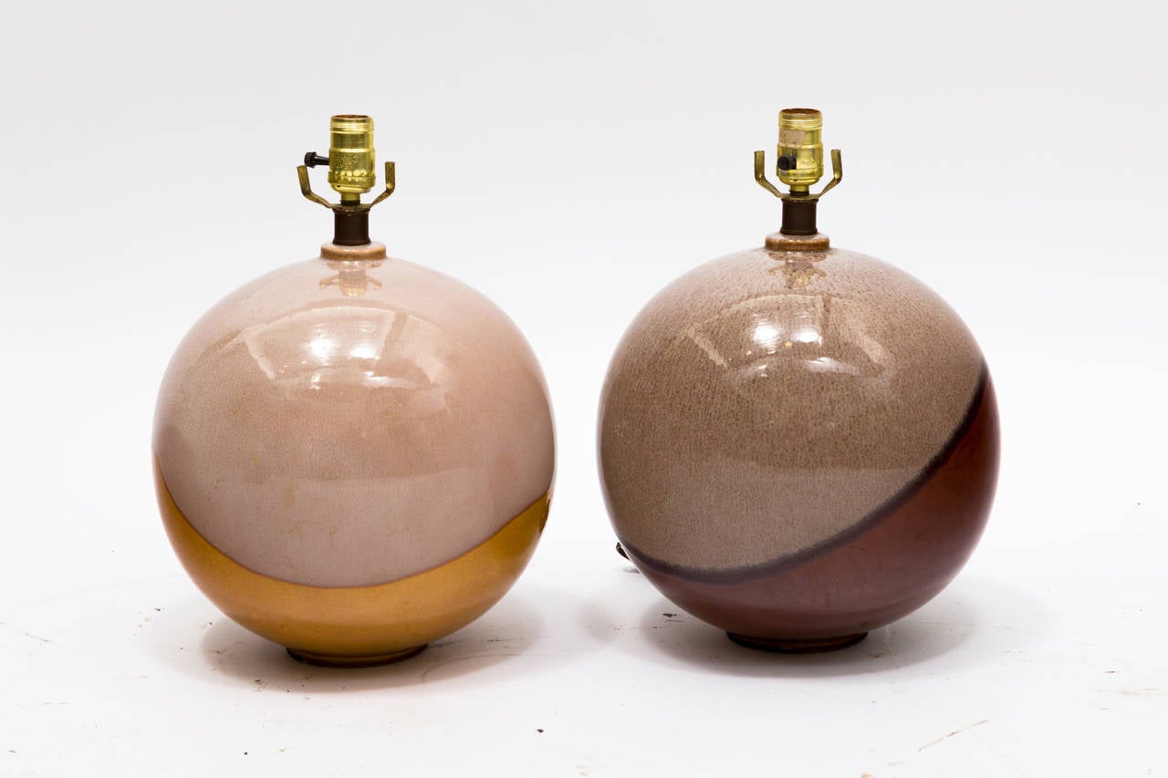Pair of ball shaped ceramic table lamps.