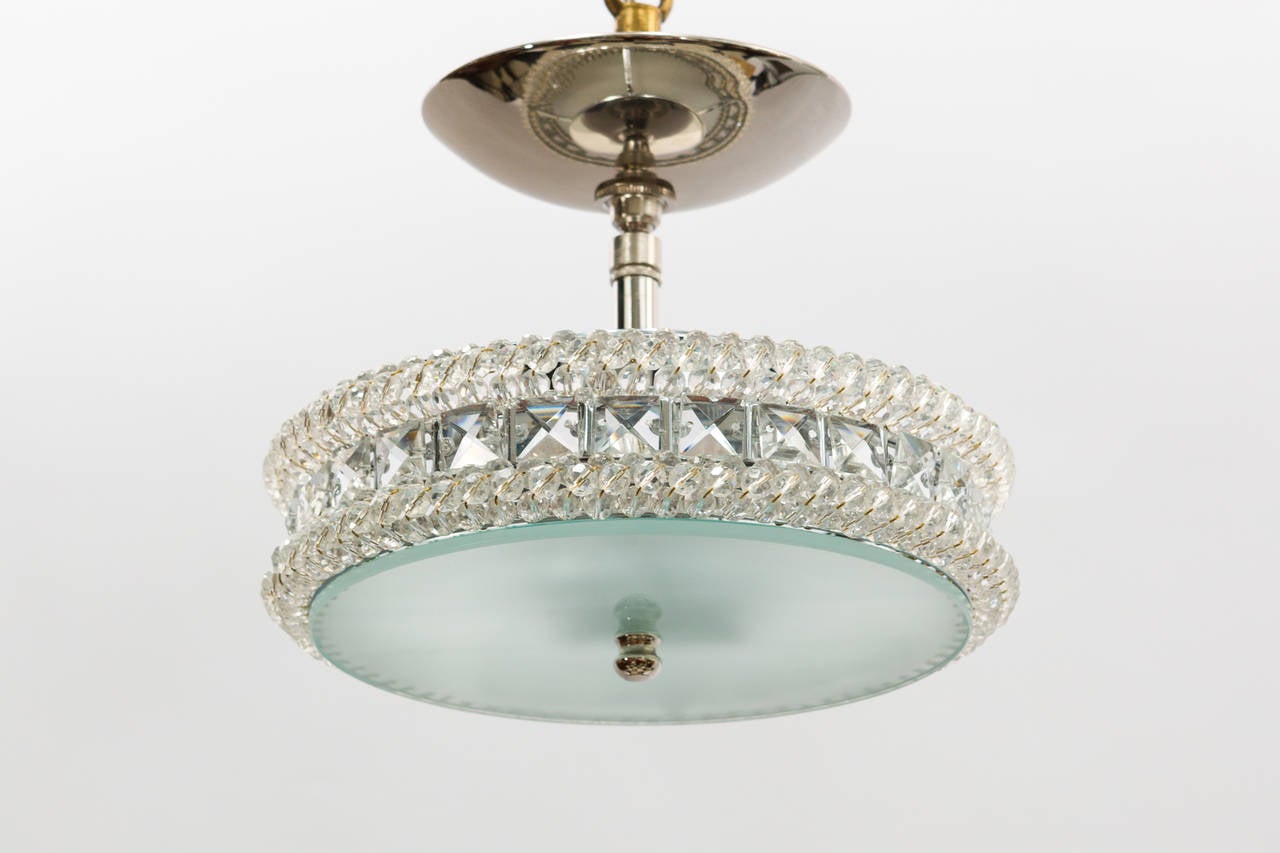 This custom crystal chandelier designed by Marcello Bessa glimmers like a piece of jewelry floating in the sky. A one of a kind piece.