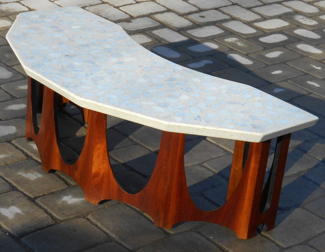 Nice Harvey Probber demi lune coffee table with a terrazzo top. Nice walnut base.