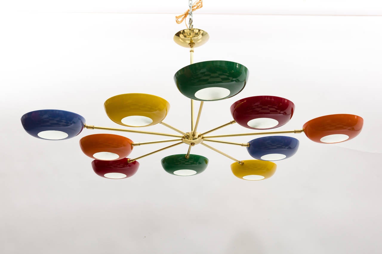 Ten-arm chandelier in the style of Stilnovo. Frosted glass fittings at the bottom of each standard base (E26).socket.
It can be ordered in multiples and customized with different finishes and colors.
Newly rewired.
Max. 100 watts per