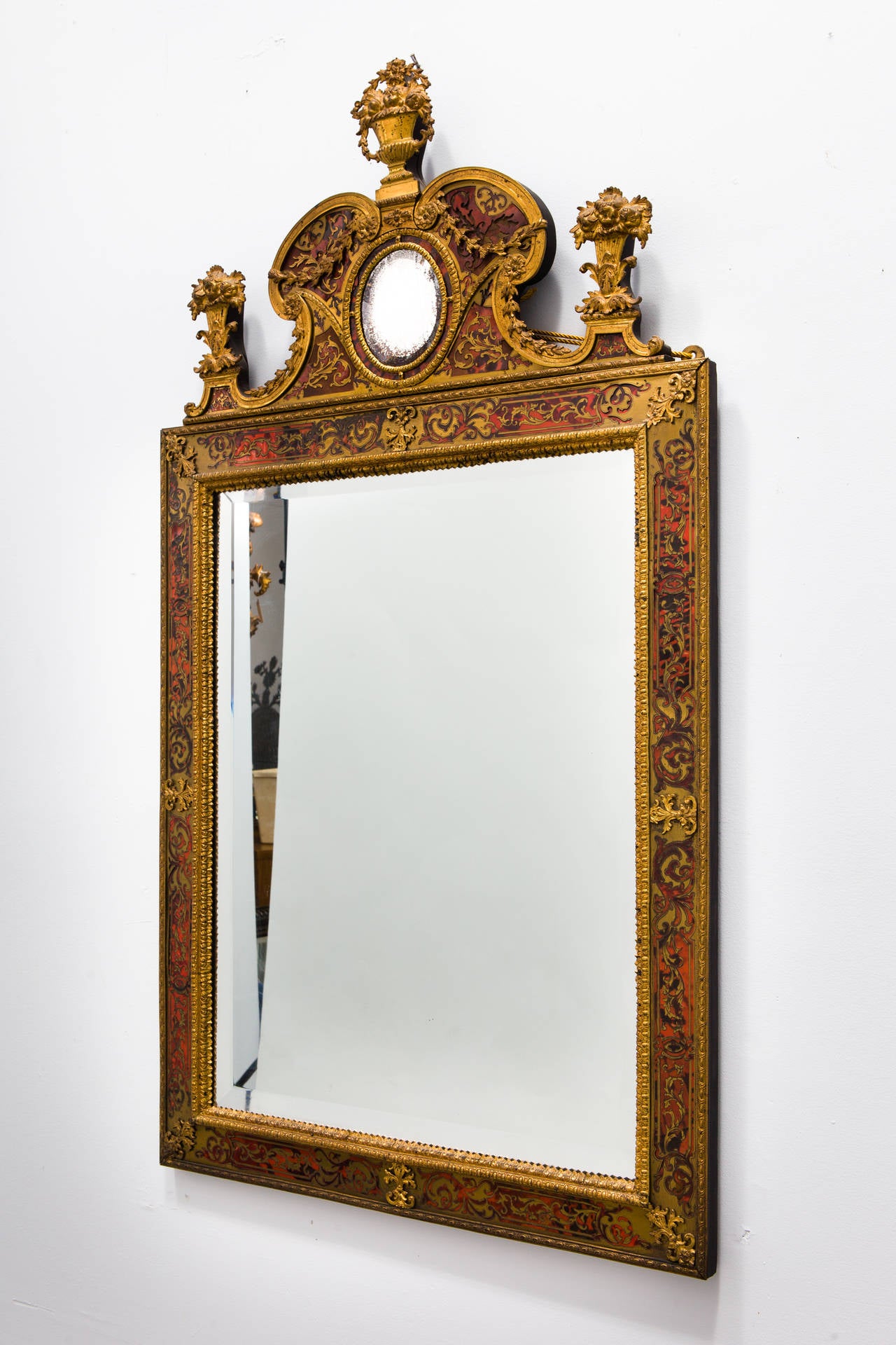 In the Louis XIV style, circa 1860. Rectangular beveled mirror with Boulle frame.

In 1999 the identical mirror sold at Christies in London for $ 7573.
In 2007, again the identical mirror sold at Christies New York for $8125.