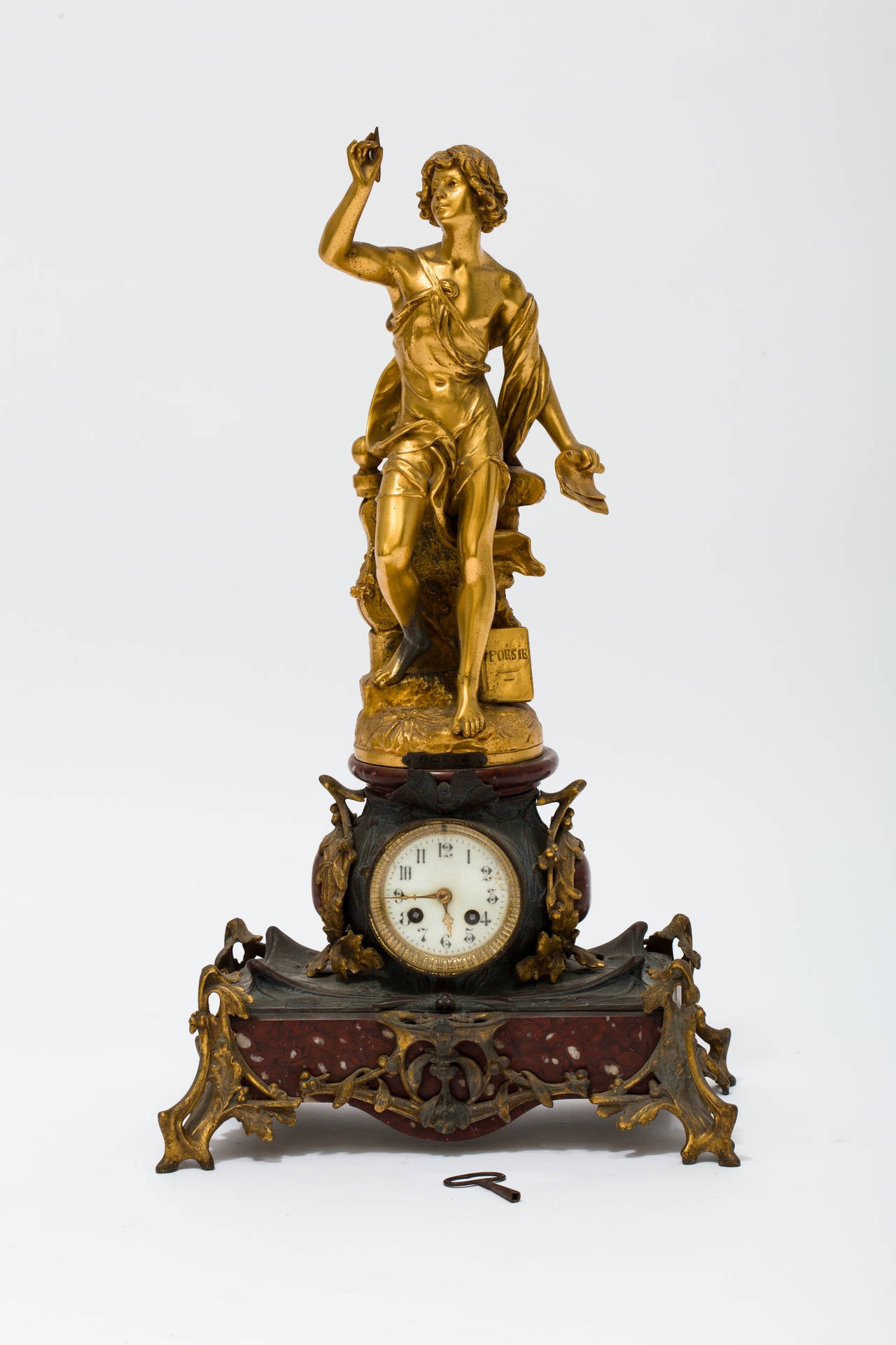 Gilt metal figure, signed Bruchon, on a clock base. Clock is not working