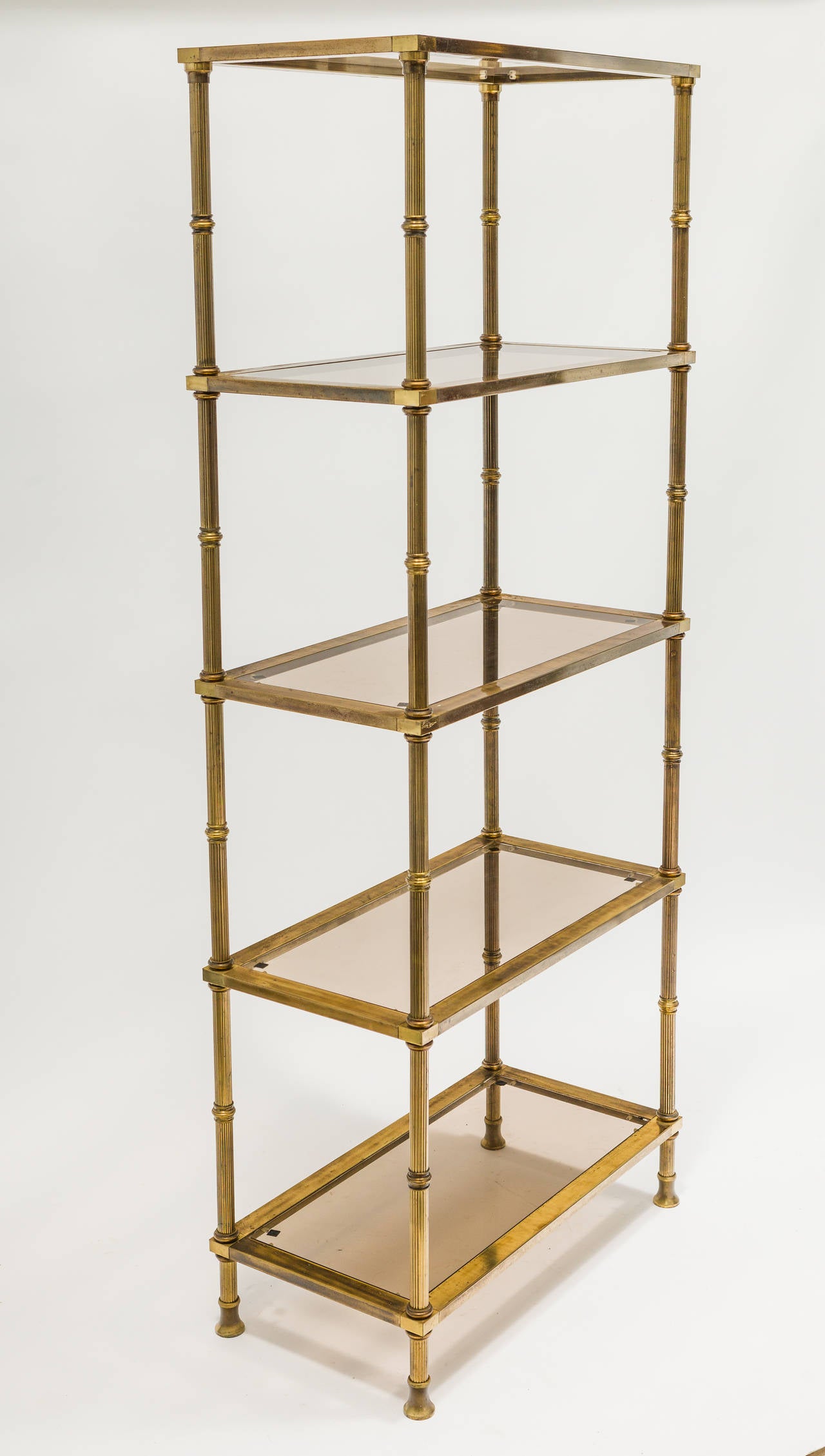Pair of Regency style brass plated and glass shelf etageres.