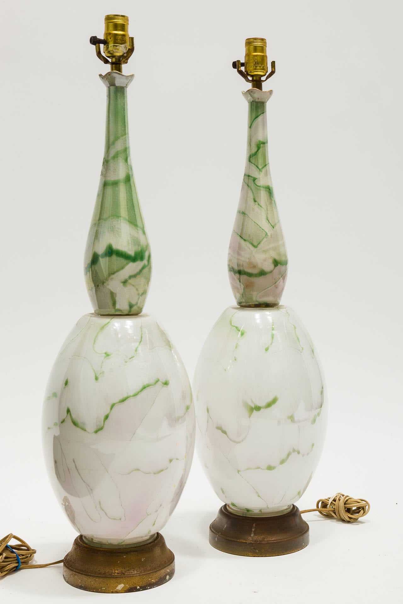 Pair of midcentury green and white colored glass lamps.