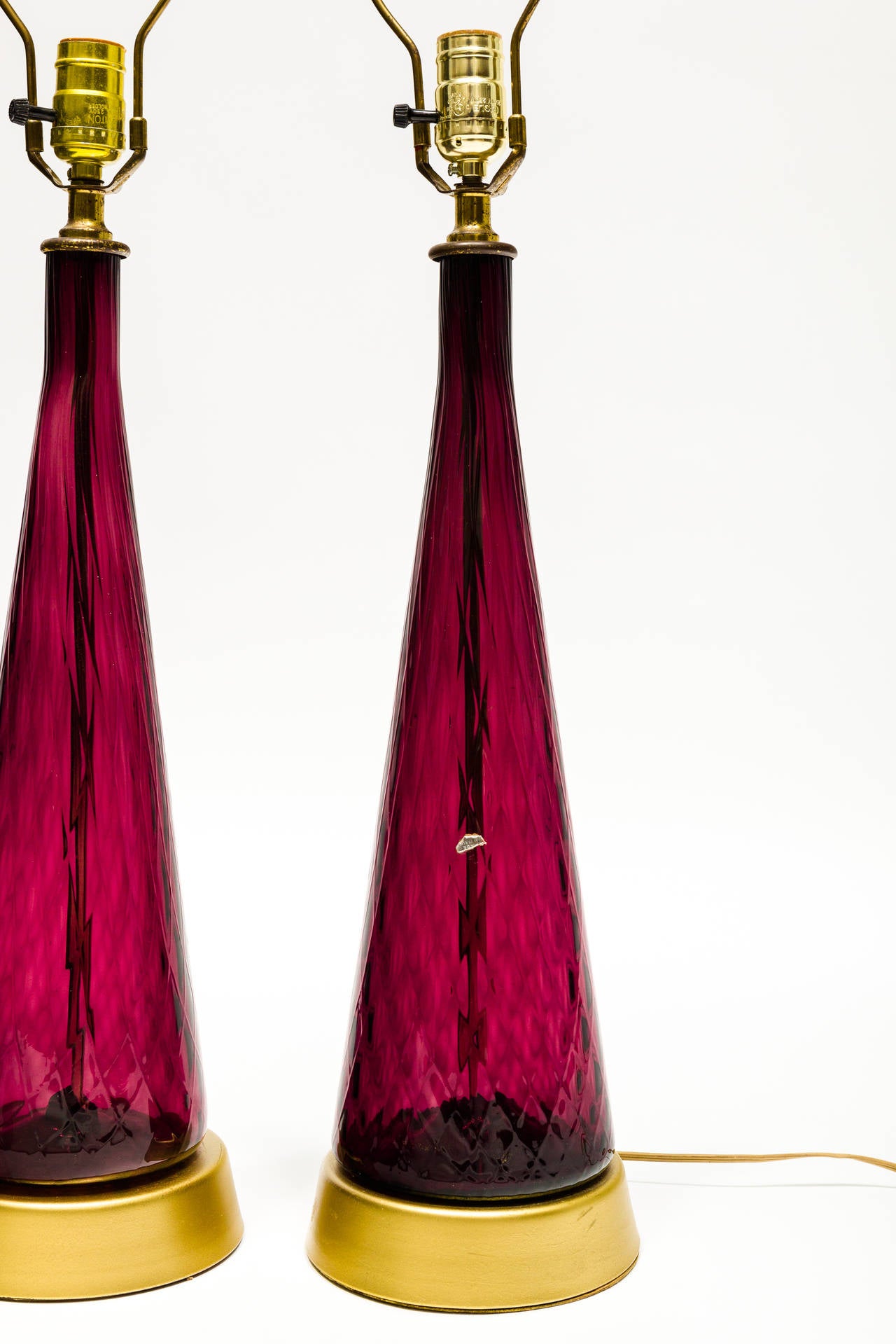 Pair of Murano glass table lamps. They have a diamond shaped pattern and partial label of 