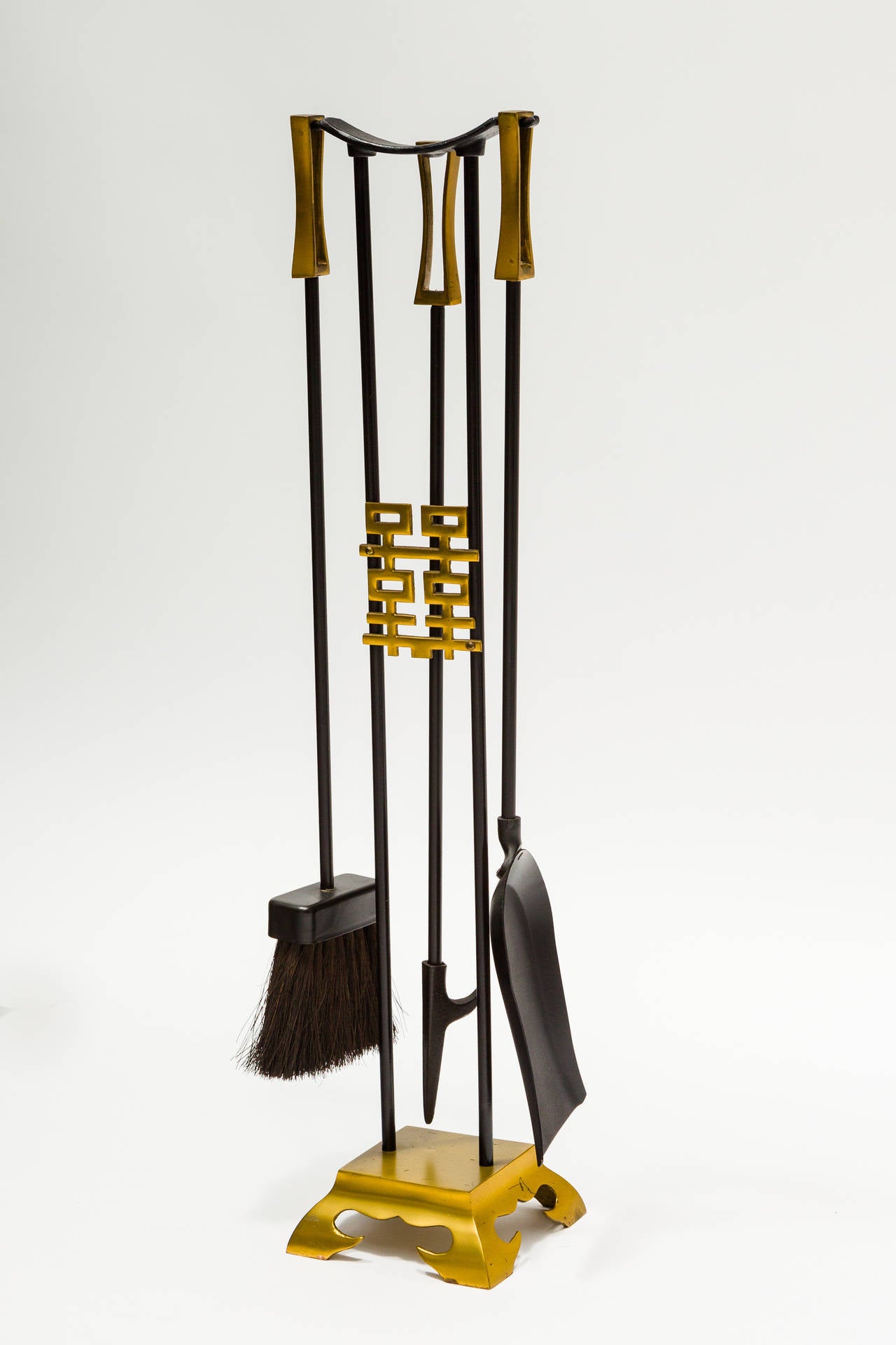 Brass and steel Asian modern fireplace tools and holder.