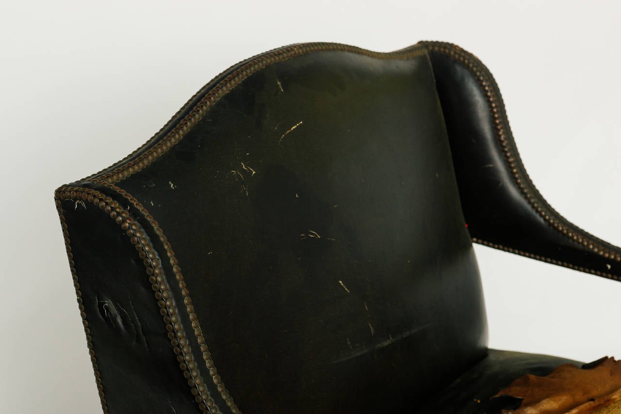 Carved wood chair and a half, original leather, Needs to be reupholstered